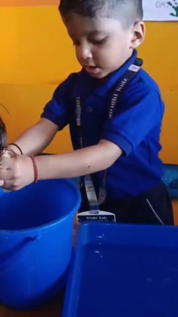 A child busy with a water-play activity